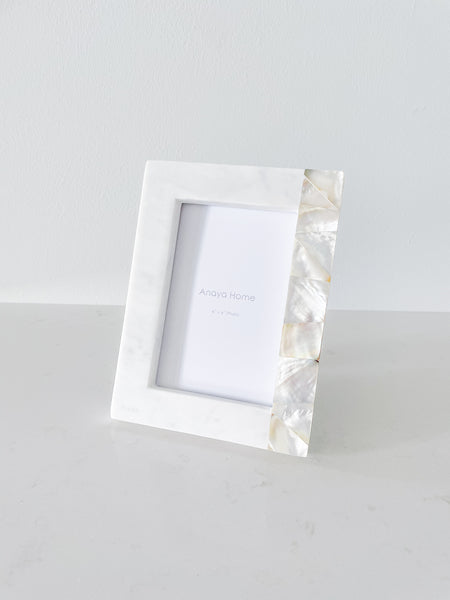 https://www.anayahome.com/cdn/shop/products/Anaya-Marble-Mother-Of-Pearl-White-PictureFrame-4X62_grande.jpg?v=1697509534